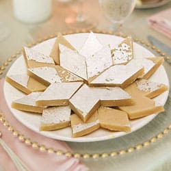 Relishing Badam Barfi from Haldiram...