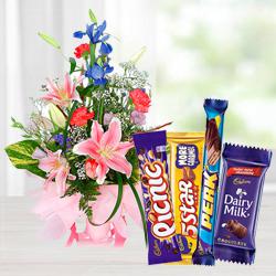 Charming seasonal Flowers with mouth-watering mixed Cadburys Chocolate Charming seasonal Flowers with mouth-watering mixed Cadburys Chocolate