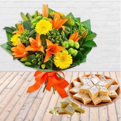 Beautiful fresh Seasonal Flower and delectable Kaju Barfi Beautiful fresh Seasonal Flower and delectable Kaju Barfi