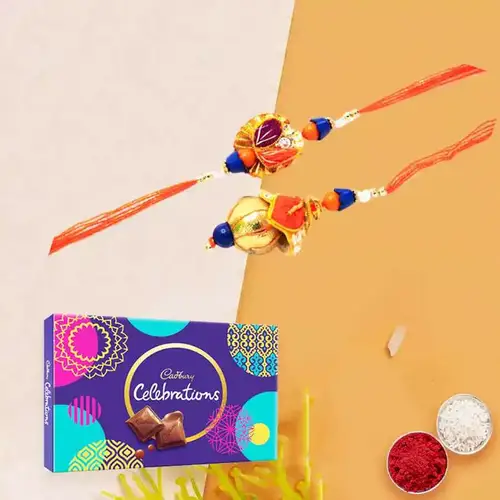 Lovely Rakhi celebration pack with Bhaiya Bhabhi Rakhi, free Roli tika and Chawal