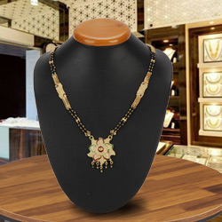 Feminine Gold Toned Metal Mangalsutra with Floral Design Feminine Gold Toned Metal Mangalsutra with Floral Design