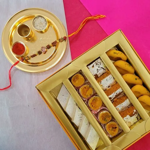 Impressive Ganesh Rakhi with Sweets  N  Golden Rakhi Thali