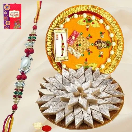 Delicious Kaju Katli and Designer Pooja Thali along Rakhi, Roli, Tilak and Chawal