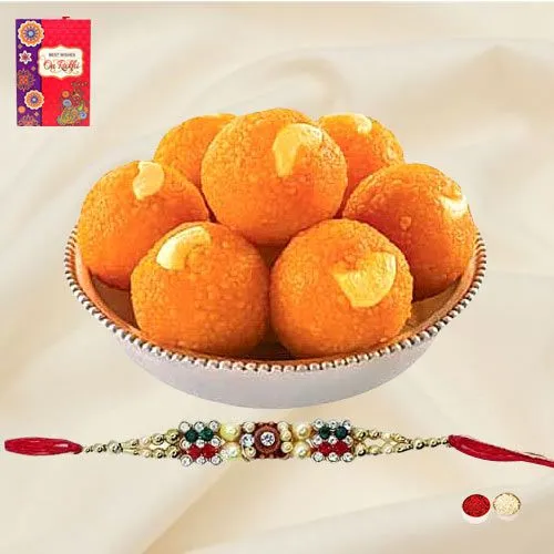 A Free Decorative Rakhi, Roli Tilak and Chawal with <font color=#FF0000>Haldiram</font> Pure Ghee Ladoo